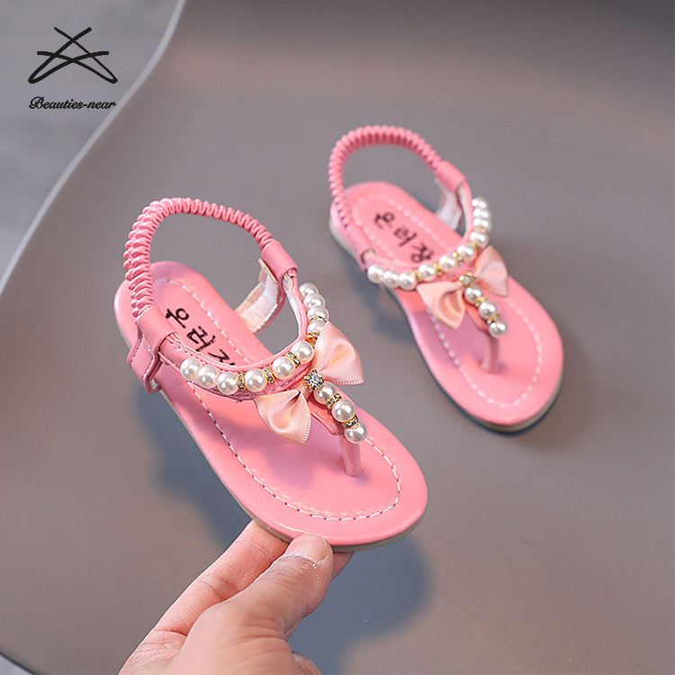 Sandali per bambini moda bambina scarpe per ragazze fiore fiocco nodo dolce  bambini piatto gomma perla Walking Jelly perizoma sandalo scarpe