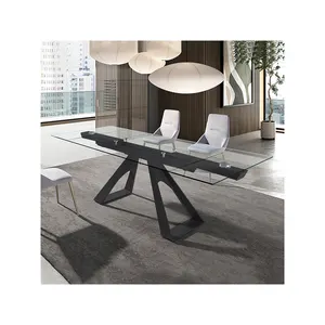 优雅的黑色玻璃延伸餐桌家具，带金色或黑色三角形金属腿