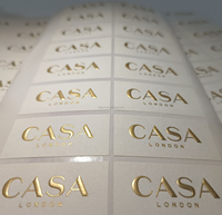 Etiquetas de Papel Texturizado con Logotipo Personalizado, 120gsm, Cuadradas, con Estampado Dorado Mate, al Mejor Precio de Fábrica y Alta Calidad