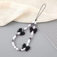 Accessoire de mode coréenne : Lanière de téléphone avec nœud, cœur et perles imitation, chaîne perlée, bracelet de poignet mignon pour téléphone portable
