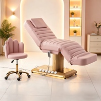 Lit de beauté électrique en cuir PU rose avec base dorée, inclinable et réglable pour les soins cosmétiques