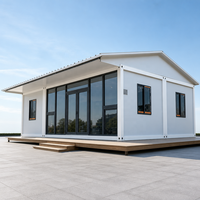 Maison modulaire de luxe en verre, maison conteneur détachable, maison préfabriquée avec toit en pente pour hôtel-resort