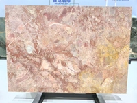 Dalles de marbre rose quartz de luxe pour revêtements de sol, murs d'accent rétroéclairés, îlots cascade et lavabos sculpturaux à veinage apparent