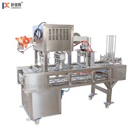 Machine automatique de cachetage de tasse de yaourt et de jus de petite taille Machine de conditionnement multifonctionnelle de tasse en plastique pour des usines
