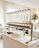 Distributeur de parfum manuel de luxe, machine de remplissage et de présentation de liquides en verre à 12 têtes multiples