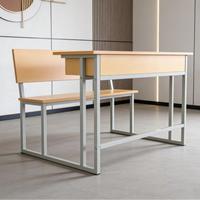 Ensemble de chaises de bureau métalliques intégrées modernes à double siège, couleur et taille personnalisables pour étudiants, écoles, cours de formation et bureaux d'écriture