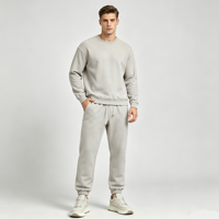 Pantalon de jogging fuselé beige pour homme avec revers côtelés, poche plaquée pentagonale, taille élastique avec cordon de serrage, poche oblique et fausse braguette, style décontracté