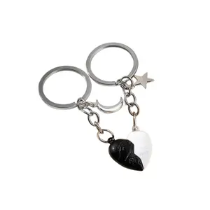 Hot selling creative couple magnetic black and white love pair keychain backpack phone case decoration pendant Key Ring