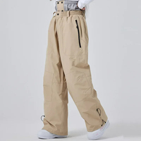 2025 nouveaux hommes femmes Sports de plein air ski pantalon coupe-vent imperméable hiver Ski snowboard pantalon chaud lâche neige sac