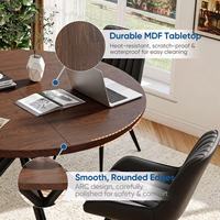 Table à manger ronde moderne en bois massif avec design imperméable et durable, pieds croisés en métal noir et pieds réglables pour la cuisine