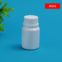 Bouteille de pilules en plastique de catégorie comestible de supplément pharmaceutique résistant à la lumière blanc de HDPE avec le bouchon à vis