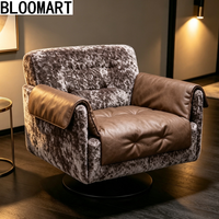 Fauteuil pivotant de luxe en cuir mélangé, rembourré de plumes, avec base pivotante en carbone noir mat