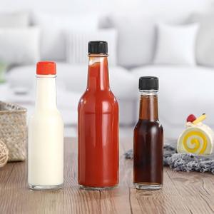 Bouteille de sauce piquante en <span class=keywords><strong>verre</strong></span> transparente personnalisée, ronde, en gros, 100 ml, 150 ml, 5 oz, 8 oz, vide - Product Image 1