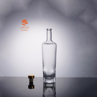 Bouteille de liqueur en verre transparent cylindrique de 700 ml, bouteille en verre à fond épais irrégulier pour la vodka, le gin, les spiritueux, vente en gros