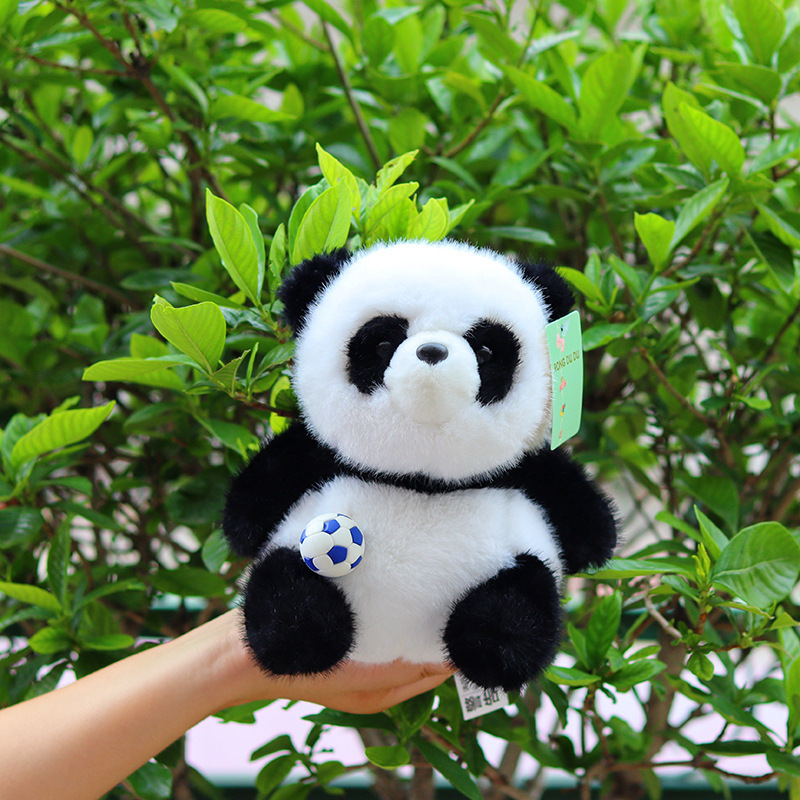 Panda couché noir et blanc [poupée]