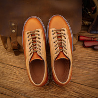 Les dernières chaussures en cuir de vachette pur haut de gamme en cuir véritable avec une couche supérieure de vêtements de travail décontractés en cuir de vachette pour chaussures pour hommes