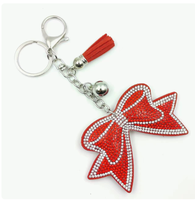 Koningsblauwe modieuze strikvormige sleutelhanger met volledig bezette strass steentjes en kwastjes, hoogwaardig, best verkochte charme hangende ornament