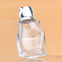 Flacon de parfum en verre transparent de 50 ml, forme incurvée unique, bouchon chromé argenté, rechargeable