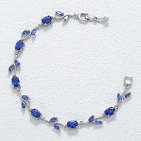 Bracelet unisexe tendance en forme de feuilles torsadées plaqué or avec zircon, idéal pour la vente en gros