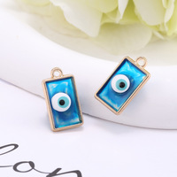 Pendentif minimaliste œil de démon en alliage et résine, pour coque de téléphone, collier DIY, accessoire, emballage, décoration, vente en gros
