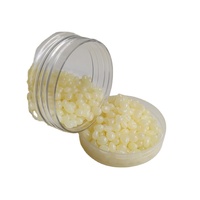 Adhésif thermofusible EVA granule jaune colle thermofusible à réglage rapide pour l'étanchéité de la boîte