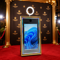 Photomaton intégré dans un cabinet, style borne interactive, avec éclairage RGB et imprimante dissimulée, idéal pour les événements commerciaux