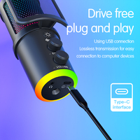 Microphone d'ordinateur de type RGB avec un bonnette anti-vent en mousse et compatible avec les smartphones pour l'enregistrement et la diffusion.