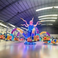 Manège en forme de grand poulpe sur le thème de l'océan pour aire de jeux extérieure, fête foraine, équipement d'amusement familial rotatif