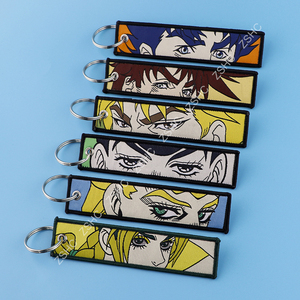 Nouvelles tendances JOJO Anime porte-clés en gros personnalisé brodé porte-clés tissé avec logo dessin animé décorer porte-clés - Product Image 4