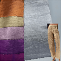 Vente directe d'usine, cuir synthétique PU brillant extensible et imperméable, produits en stock, vêtements, pantalons, jupes