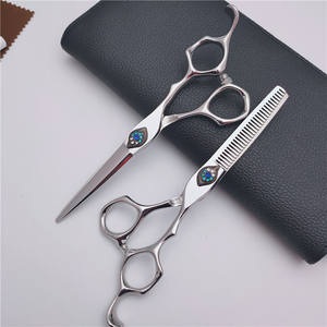 Tijeras de Entresacar Personalizables de 6.0 Pulgadas de Acero Inoxidable para Diestros, con Tuerca Cola de Fénix de 30 Dientes - Product Image 3