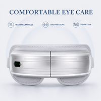 Masque de massage oculaire haut de gamme OEM ODM avec pression d'air, compresse chaude, vibration, musique, 5 modes, pliable, sans fil, rechargeable par Type-C