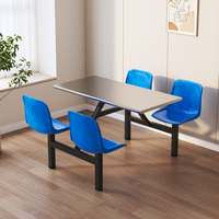 Table de cantine moderne et durable en acier inoxydable avec tabourets intégrés pour 4 personnes, idéale pour les cantines scolaires ou les messes du personnel