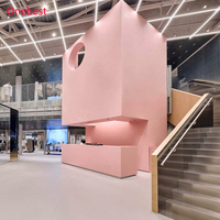 Comptoir de caisse moderne en surface solide rose pour magasin de vêtements pour femmes et dames, kiosque d'accueil, présentoir