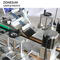 Machine d'étiquetage automatique ZONESUN ZS-TB822X pour bouteilles carrées, avec étiquetage enveloppant du couvercle, des bords et des côtés, pour étiquettes adhésives.