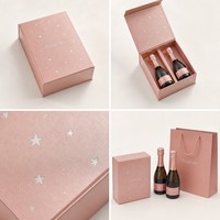 Boîte cadeau mini champagne personnalisée double bouteille en carton rose doré perlé avec étoile argentée en feuille d'aluminium, format fête, emballage champagne