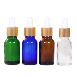 Flacon compte-gouttes ovale en verre vert avec anneau doré, surface transparente, adapté pour l'emballage cosmétique d'huiles essentielles de 15 ml, compte-gouttes en caoutchouc. - Product Image 3