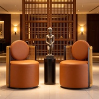 Fauteuil lounge moderne de luxe en corde tressée avec accents en cuir, coussin rond, pour hall d'hôtel, bureau, café, mobilier