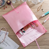 Sac d'enveloppe d'emballage de perruque de cheveux de satin rose imprimé de logo personnalisé pour l'expédition et le stockage cosmétique pochette cadeau de flexographie