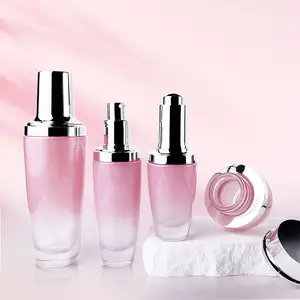 Custom cosmetic pink glass packaging set 30ml serum oil bottle 50ml 100ml toner emulsion pump bottles 20g pink cream glass jar