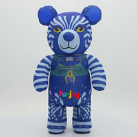 Costume de mascotte gonflable d'ours bébé imprimé sur mesure avec motif bleu, sucette et couche pour spectacle de festival