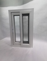 Ventana corredera de PVC con diseño de parrilla y mosquitera