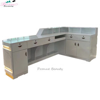 Nouveau design moderne personnalisé bureau de caissier incurvé en L bureau de réception à DEL marbré pour salon de beauté