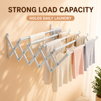 Séchoir à linge mural rétractable et pliable pour extérieur, avec système de tirage et de poussée