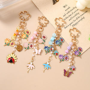 Nuevos modelos transfronterizos: Llaveros de cuentas, llaveros de mariposa, mariquita y flor, y dijes para bolsos, los más vendidos y clasificados. - Product Image 5