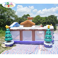 Parc de jeux gonflable de Noël en forme de cabane d'hiver, maison de jeu gonflable à thème de Noël pour enfants avec toboggan pour fêtes et divertissements