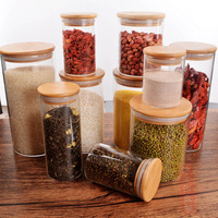 Fourniture de couvercle en bois de bambou pot de stockage en verre assaisonnement thé pot de fruits secs pour l'utilisation de fête stockage des aliments bouteille en verre artisanale