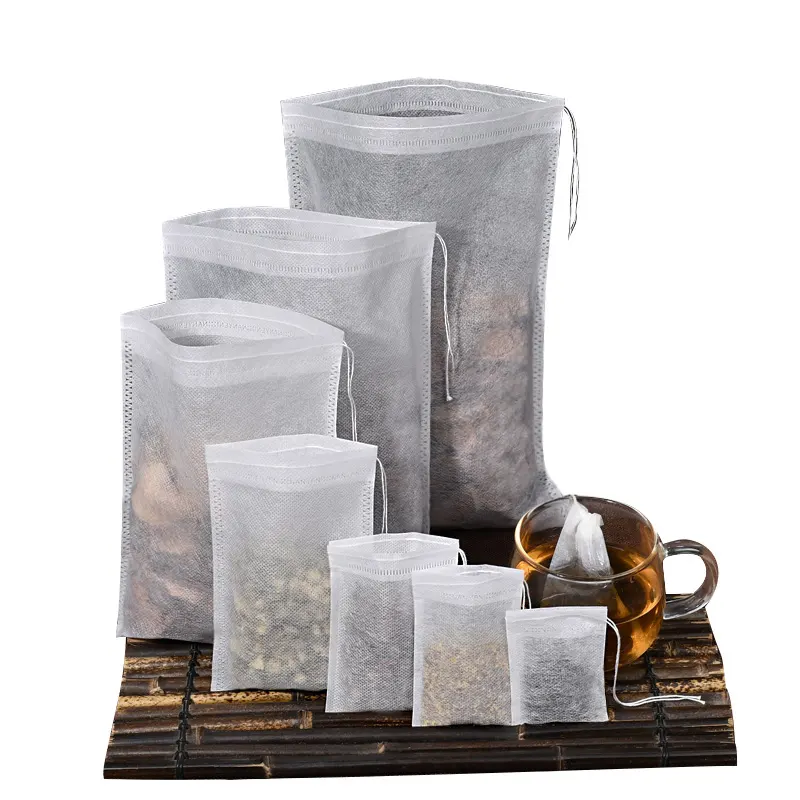 Sachets de thé biodégradables en stock avec cordes de tirage en coton Sachet de thé filtre en pâte de bois écologique Sachets de thé vides thermoscellés en feuilles mobiles
