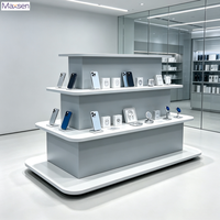Vitrine d'exposition multi-niveaux Maxsen gris et blanc avec éclairage LED, écologique et robuste, pour magasin de téléphonie mobile