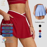 Nouvelle jupe-short athlétique douce pour femme 2-en-1 froncée à taille croisée en V, jupe de tennis avec poches, pour yoga, sport, fitness, séchage rapide, entraînement